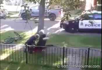 Video shows Edmonton officer jump knee-first onto man lying on ground during 2019 arrest - Edmonton Journal