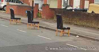 Chairs 'placed on city road to reserve parking spaces'