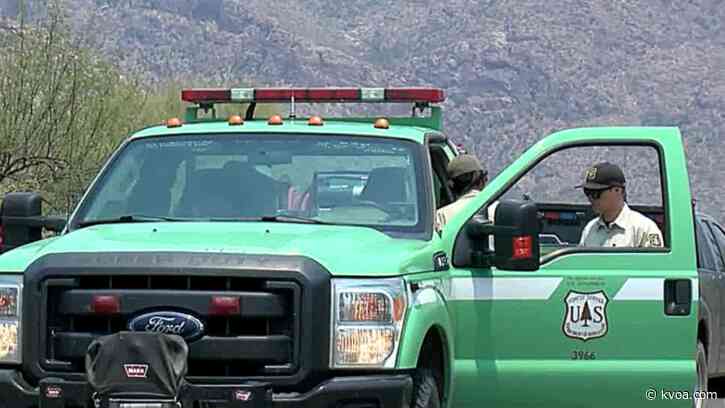 Fire crews continue working to contain blaze amid shifting winds