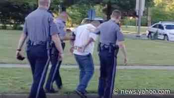 KKK leader arrested after driving into protest in Virginia