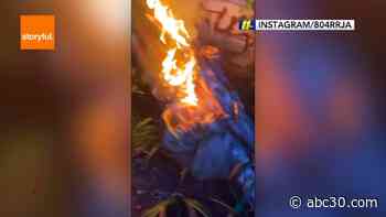 Christopher Columbus statue toppled, set on fire and thrown into lake in Richmond, Va.