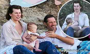 Milla Jovovich, 44, and husband cradle new baby girl Osian