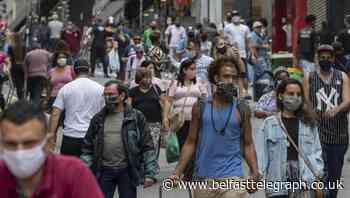 Busy shops and packed buses as Sao Paulo reopens amid coronavirus pandemic