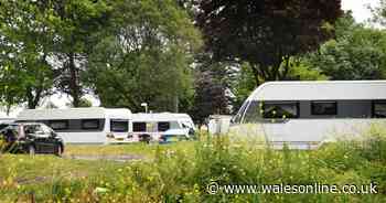 Travellers with up to a dozen caravans pitch up at popular beachfront car park