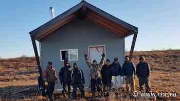 N.W.T. man rescued his sinking cabin with the help of friends — and a fleet of snowmobiles