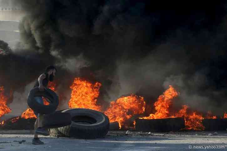 Lebanon to inject dollars as currency plunge revives protests