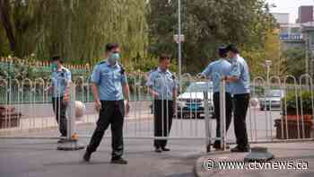 Beijing closes market, locks down area in new virus outbreak