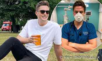 Dr Alex George enjoys a cool beer as he relaxes in the park on his day off