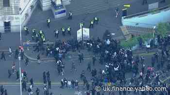 Protesters and police collide as curfew starts