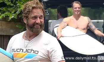 Gerard Butler catches some waves while surfing with his friend Joel Kinnaman in Malibu