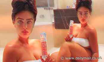 Lauren Goodger sizzles in a strapless white bikini for racy bathroom snap