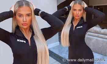 Molly-Mae Hague slips into a black zip up catsuit as she moves into a lavish new pad