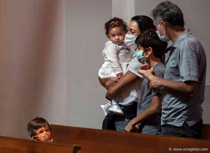 Parishioners flock to Catholic churches’ first in-person services in months