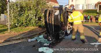 Woman cut free as Range Rover ploughs into lamppost and flips