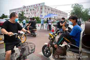Beijing closes food market, locks down district after new coronavirus outbreak