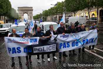 French police throw down handcuffs, 'insulted' after being accused of brutality, racism