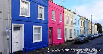 Quirky landlady brightens up street by painting houses in rainbow colours