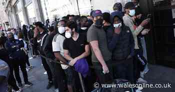 Tightly-packed crowds form outside Nike as shops reopen in England