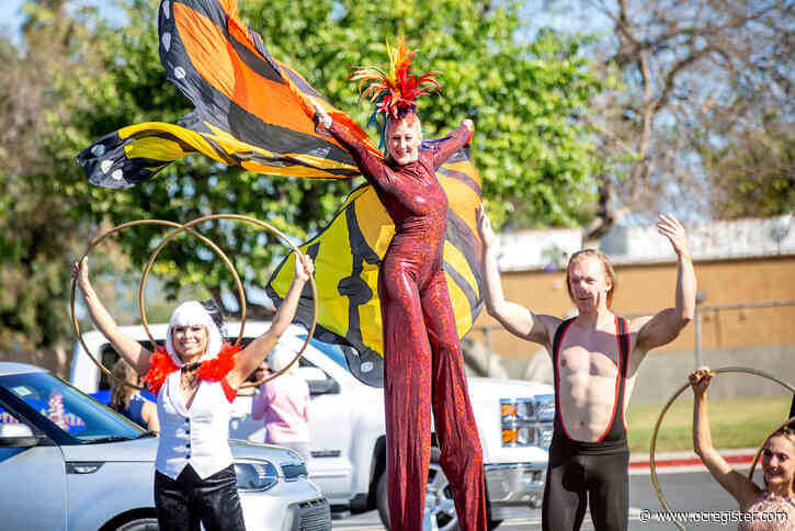 Graduating students saluted … by circus performers