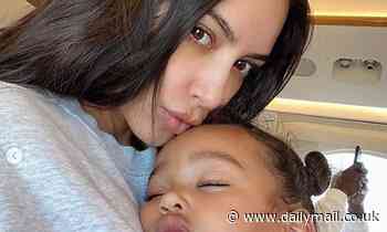 Kim Kardashian looks simply radiant as she cuddles up to little Chicago West in makeup free selfie