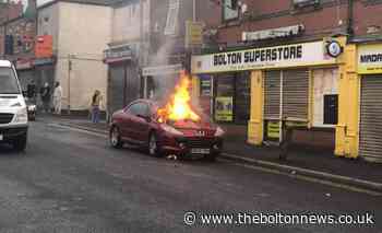 Fire crews put out car blaze in the middle of busy road