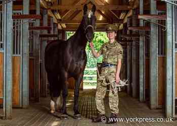 York woman who struggled with dyslexia guards Queen