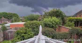 Moment incredible 'tornado' funnel cloud forms as freak storm batters region