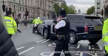 Boris Johnson's car in dramatic scenes as protester leaps out in front