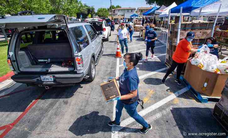 Volunteers in Fullerton distribute food kits, books in community struggling amid coronavirus pandemic