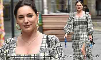 Kelly Brook goes to work in prairie dress and flatform trainers