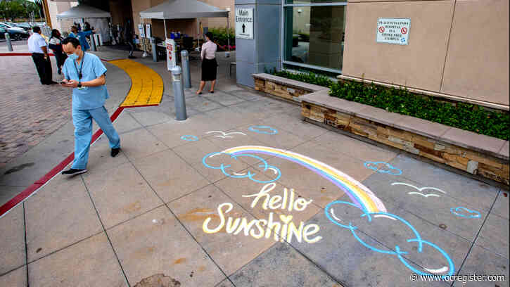 Volunteers chalk inspirational drawings, messages outside Placentia-Linda Hospital