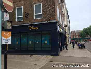 Shoppers told to cover faces as city centre Disney store reopens