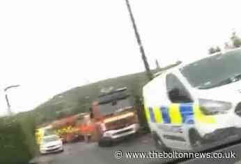 Firefighters rescue woman from water at Holcombe Brook