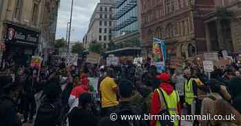 Moment protesters halt on city street to mark lives of those killed in custody