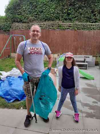 Father and daughter clean up their streets