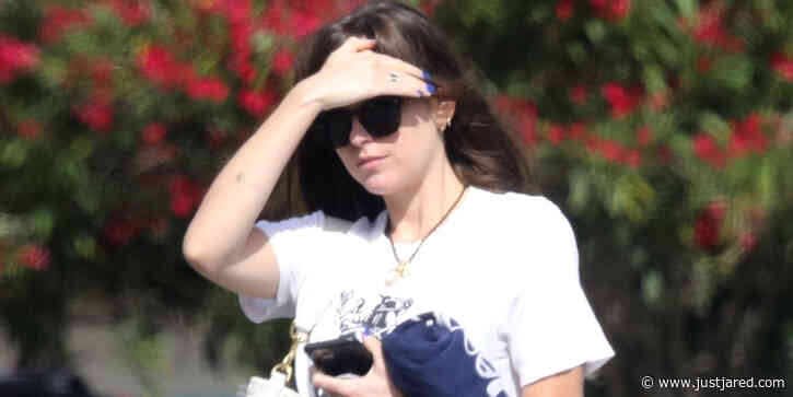 Dakota Johnson Fights The Bright Sunlight While Running Errands in LA