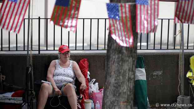 Metal barriers, Trump gear: Crowd readies for Tulsa rally