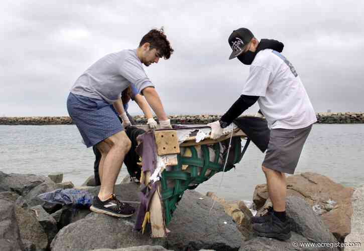 Helpers spruce up the sand at Seal Beach beach clean up