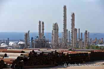 International nuclear watchdog puts pressure on Iran to cooperate, 'immediately comply' with safeguards