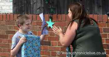 People line street to welcome boy, 10, back home after tumour treatment