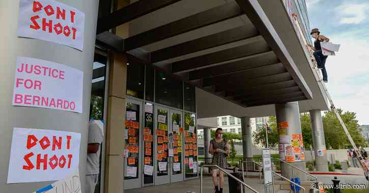 Protesters cover Salt Lake County district attorney’s office with signs demanding ‘Justice for Bernardo’