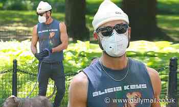 Justin Theroux shows off his bulging biceps in vintage Alicia Keys tank while walking his dog in NYC