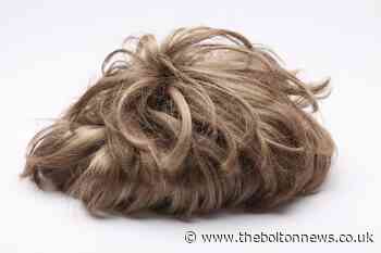 Woman banned from wearing wig in shops