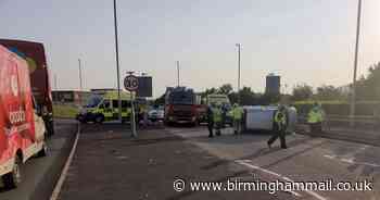 Woman injured in crash after car overturns near hospital