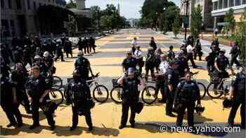 Officers clear protesters from outside the White House