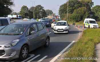 Woman left hanging by seat belt after crash helped by man