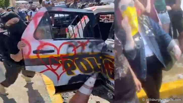 Pittsburgh Police Seeking To Identify 2 People Accused Of Vandalizing Cop Car During Riots