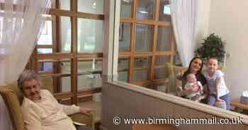 Woman, 93, meets great grandson for first time through glass window