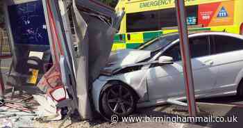 Mercedes crashes into city bus stop as driver has medical episode