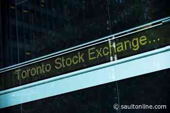 North American stock markets down in early trading, loonie falls